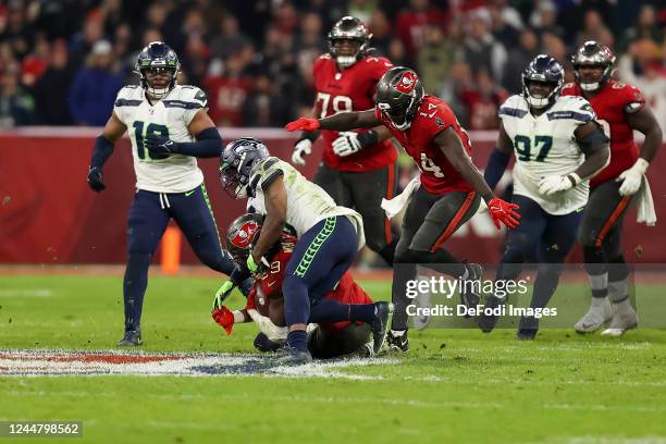 Uchenna Nwosu of Seattle Seahawks, Ryan Neal of Seattle Seahawks, Rachaad White of Tampa Bay Buccaneers and Chris Godwin of Tampa Bay Buccaneers...