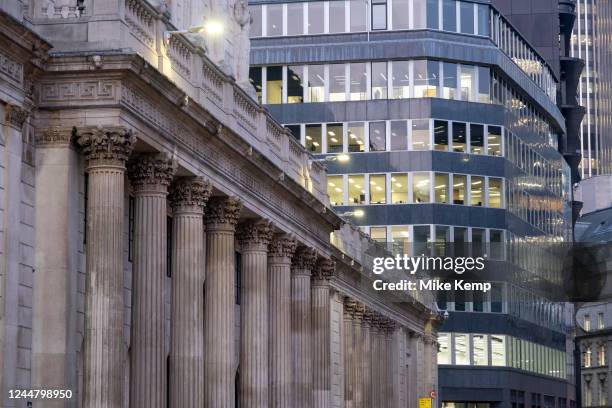 Columns outside the Bank of England and nearby glass buildings in the City of London as the UK once again slumps into a recession on 14th November...