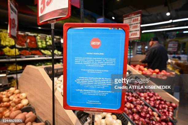 Placard informs customers about the extention of the price cap to other basic products like potatoes and eggs, in a supermarket in Budapest, on...