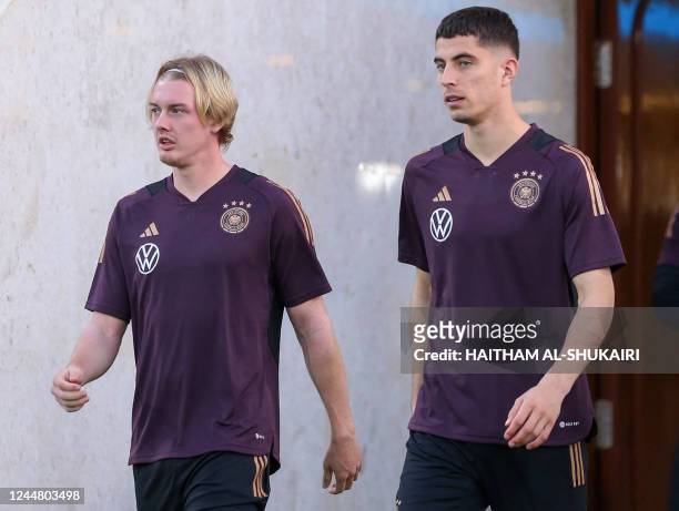 Germany's midfielders Julian Brandt and Kai Havertz attend a training session in the Omani capital Muscat on November 15 on the eve of a friendly...