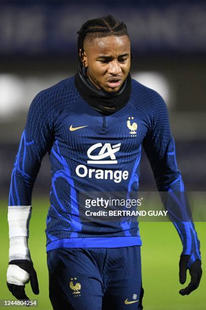 France's national football team forward Christopher Nkunku looks on during a training session at the team's training camp in...