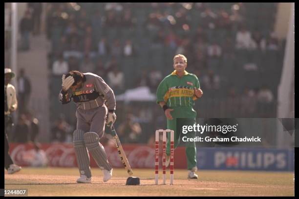 Allan Donald of South Africa hits Sultan Zarawani of the United Arab Emirates on the head with the cricket ball during the cricket world cup in...