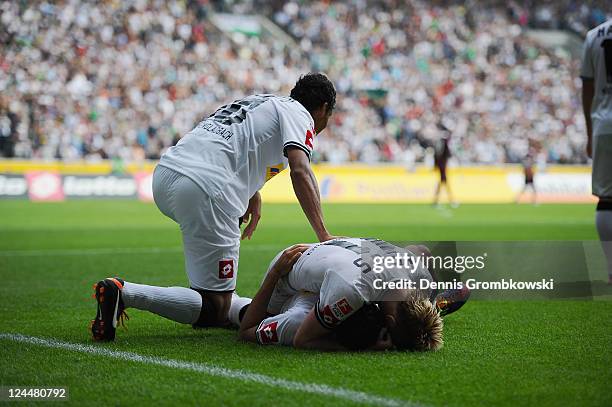 Juan Arango of Moenchengladbach celebrates with team mates after scoring his team's opening goal during the Bundesliga match between Borussia...