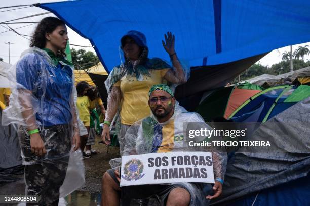 Supporters of Brazilian President Jair Bolsonaro camp during a demonstration against the results of the runoff election, in front of the Eastern...