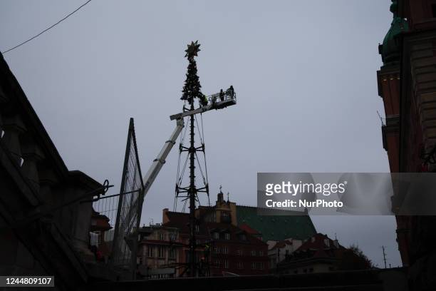 The yearly, traditional Christmas tree is seen being constructed on the Royal Catle Square in Warsaw, Poland on 15 November, 2022. Despite concerns...