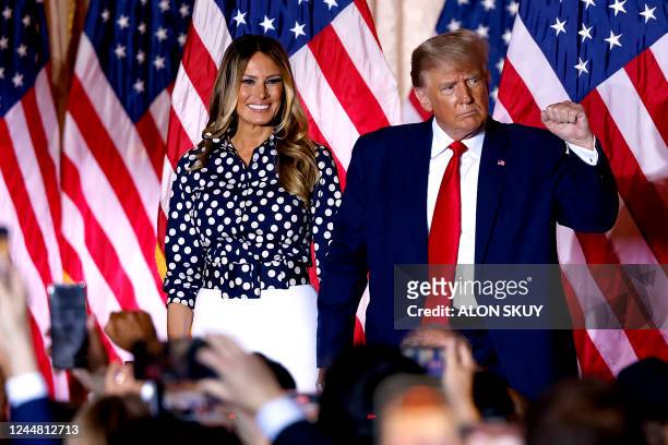 Former US President Donald Trump, joined by former US First Lady Melania Trump, arrives to speak at the Mar-a-Lago Club in Palm Beach, Florida, on...