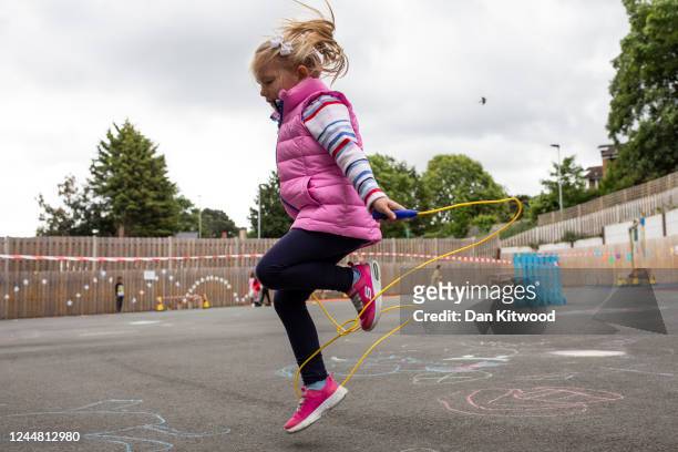 Children maintain social distancing measures as the play in the playground at the Harris Academy's Shortland's school on June 04, 2020 in London,...