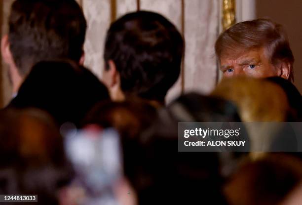 Former US President Donald Trump departs after speaking at the Mar-a-Lago Club in Palm Beach, Florida, on November 15, 2022. - Donald Trump pulled...