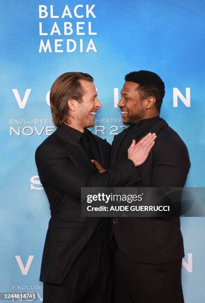 Actor Glen Powell and US actor Jonathan Majors arrive for the Los Angeles premiere of "Devotion" at the Regency Bruin Theatre in Los Angeles,...
