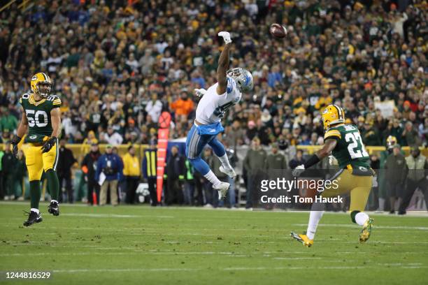 Detroit Lions tight end Eric Ebron is hit by Green Bay Packers safety Josh Jones during an NFL Monday Night Football game between the Detroit Lions...