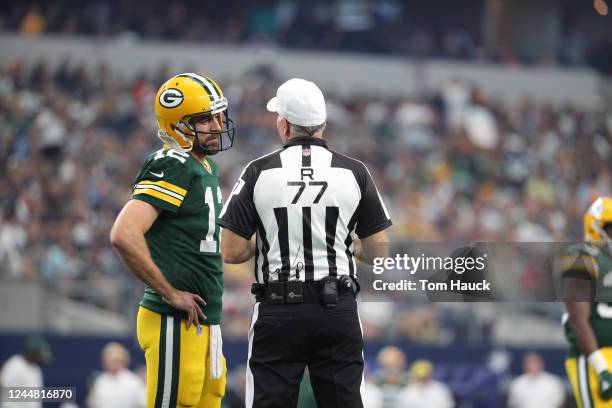 Green Bay Packers quarterback Aaron Rodgers speaks with referee Terry McAulay during an NFL football game between the Green Bay Packers and the...