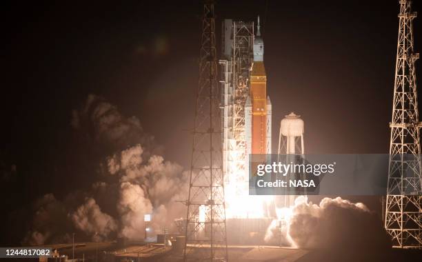 In this handout provided by the U.S. National Aeronautics and Space Administration , NASAs Space Launch System rocket carrying the Orion spacecraft...
