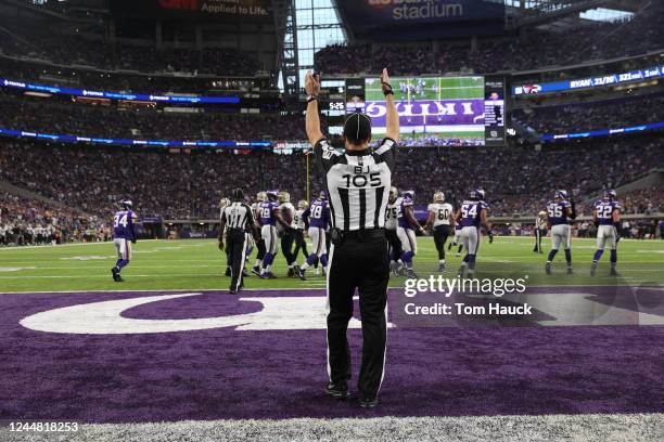 Back judge Dino Paganelli signals touchdown during an NFL game between the New Orleans Saints and Minnesota Vikings on Monday, Sept. 11 in...