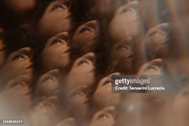 multifaceted reflection of a young woman's face in a window. - kopf an kopf stock-fotos und bilder