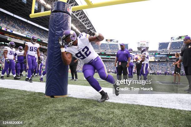 Minnesota Vikings defensive tackle Will Sutton warms up on the goal post during an NFL preseason game between the Seattle Seahawks and Minnesota...