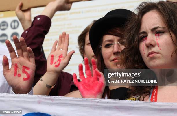 Climate activists demonstrate calling upon the G20 conference to adhere to limit global temperature rise to 1.5 degrees Celsius compared to...