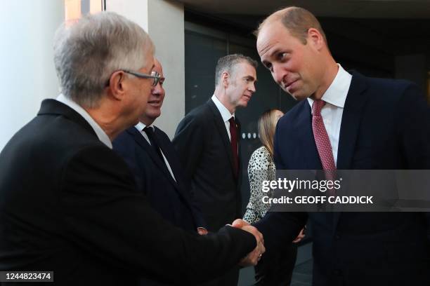 Britain's Prince William , Prince of Wales, shakes hands with Welsh First Minister Mark Drakeford as he meets with Welsh politicians during a visit...