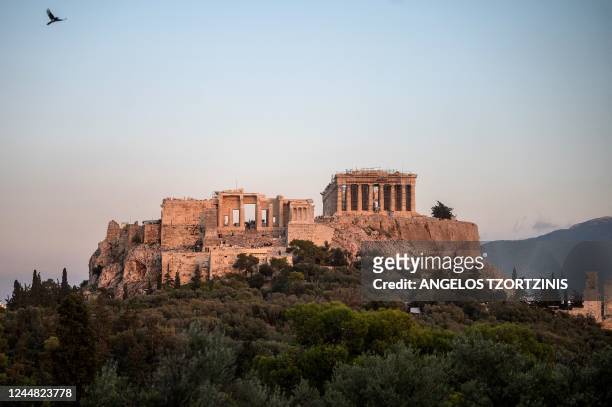 Photograph shows the Parthenon Temple at the top of the Acropolis hill in Athens on November 15, 2022. - With eighteen UNESCO World Heritage sites,...