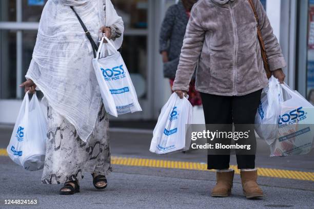 Shoppers carry Ross Stores bags outside the Mall at Prince George's in Hyattsville, Maryland, US, on Thursday, Nov. 10, 2022. Ross Stores Inc. Is...