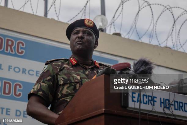 Major General Jeff Nyagah, the East African Community force commander, talks to the press upon arrival at EAC headquarters during a press conference...