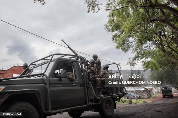 Kenyan soldiers sit on a vehicle in Goma, eastern Democratic Republic of Congo, on November 16, 2022. - A second round of Kenyan soldiers landed in...