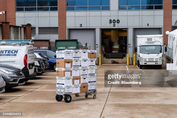 Worker transports testimony records for Elon Musk, co-founder and chief executive officer of Space Exploration Technologies Corp. And Tesla Inc.,...