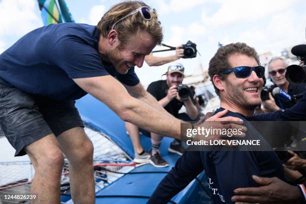 French skipper of the Ultim multihull Gitana - Edmond de Rothschild and winner of the Route du Rhum solo sailing race Charles Caudrelier celebrates...