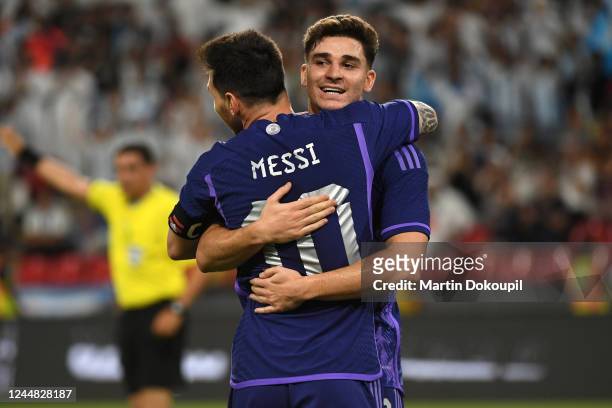 Lionel Messi of Argentina celebrates with teammate Julian Alvarez after a goal during the international friendly between United Arab Emirates and...