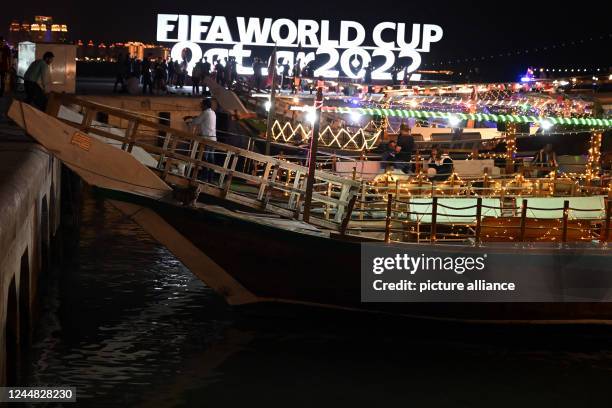 November 2022, Qatar, Doha: Dhaus lie in front of the lettering "Fifa Wordcup Qatar 2022". On , the World Cup begins with the opening match. Photo:...