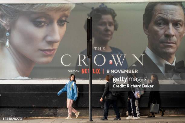 An advertising billboard promoting series 5 of Netflix's 'The Crown' which is now airing on demand, shows the main characters of the British royal...