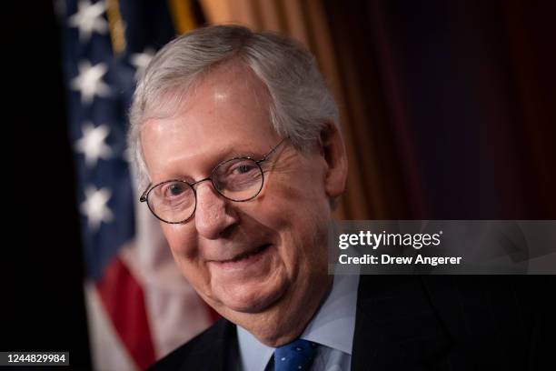 Senate Minority Leader Mitch McConnell smiles during a news conference following a meeting with Senate Republicans at the U.S. Capitol on November...