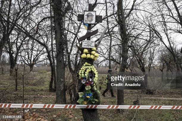 Ukrainian police, conducting investigation at a forest where Russian forces allegedly kill Ukrainian soldiers, are seen during a press tour organized...