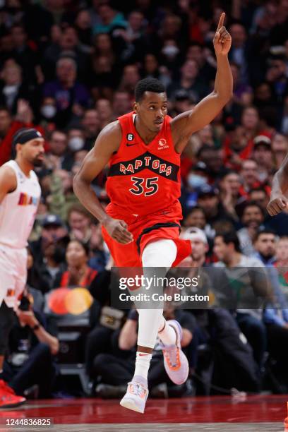 Christian Koloko of the Toronto Raptors reacts after scoring a bucket in the first half of their NBA game against the Miami Heat at Scotiabank Arena...