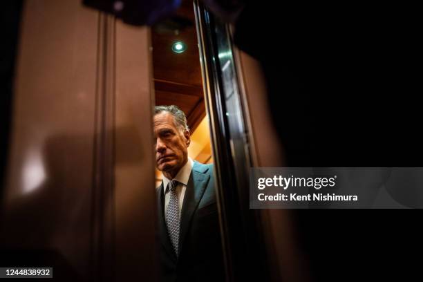 Sen. Mitt Romney speaks with reporters after leaving the Senate floor after voting yes a procedural vote on federal legislation protecting same-sex...