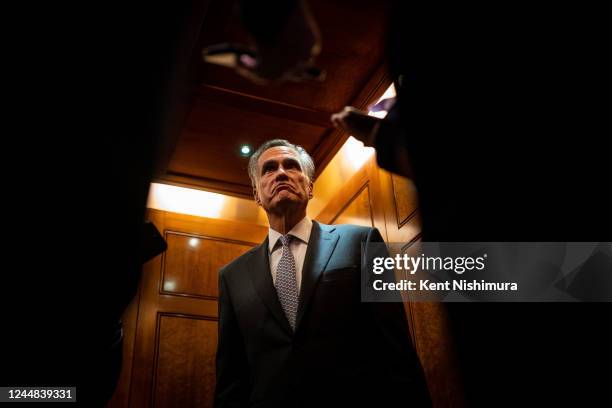 Sen. Mitt Romney speaks with reporters after leaving the Senate floor after voting yes a procedural vote on federal legislation protecting same-sex...