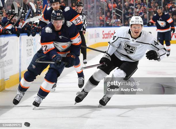 Tyson Barrie of the Edmonton Oilers and Mikey Anderson of the Los Angeles Kings pursue the puck during the game on November 16, 2022 at Rogers Place...