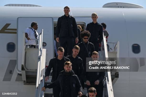 Members of the German team including Germany's goalkeeper Manuel Neuer , Germany's defender Nico Schlotterbeck and Germany's forward Serge Gnabry...