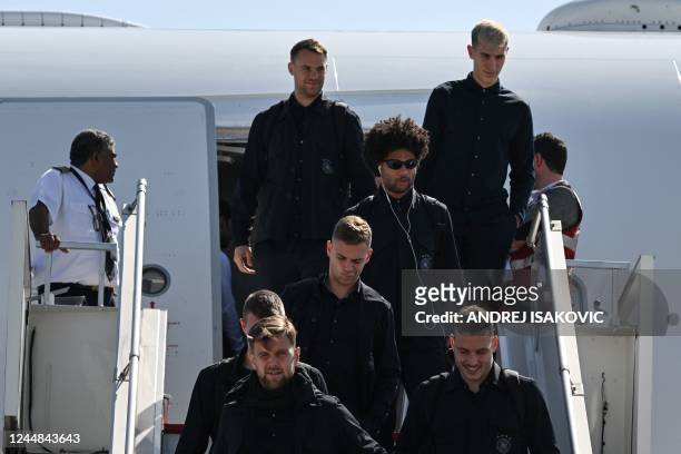 Members of the German team arrive at the airport in Doha on November 17 ahead of the Qatar 2022 World Cup football tournament.