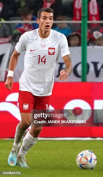 Poland's defender Jakub Kiwior plays the ball during the friendly football match between Poland and Chile in Warsaw on November 16, 2022.