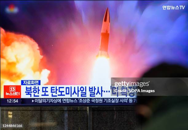 Screen shows a file image of North Korea's missile launch during a news program at the Yongsan Railway Station in Seoul. North Korea fired one...