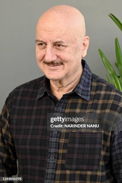 Bollywood actor Anupam Kher poses for pictures during an event on the outskirts of Amritsar on November 17, 2022.