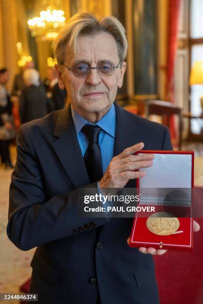 Russian-US dancer and choreographer Mikhail Baryshnikov poses with the Queen Elizabeth II Coronation Award, Royal Academy of Dance's highest honour,...