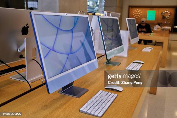 Apple's iMac products on a table in an Apple store. According to the fourth quarters financial report of Apple in 2022, sales of Mac products are...