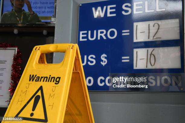 Warning sign near currency exchange rates displayed outside a bureau de change in London, UK, on Thursday, Nov. 17, 2022. UK Chancellor of the...