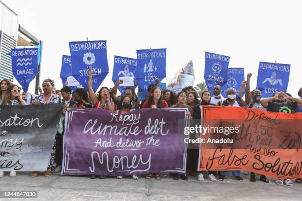 Climate activists hold demonstration that countries provide financing to eliminate the negative effects of climate change in front of the...