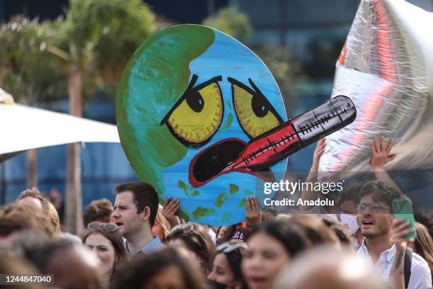 Climate activists hold demonstration that countries provide financing to eliminate the negative effects of climate change in front of the...