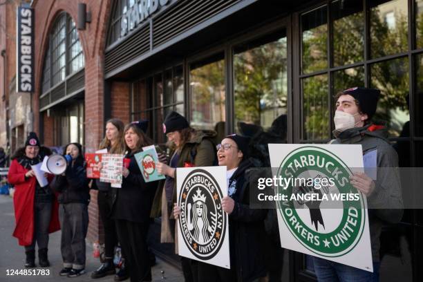 Starbucks workers strike outside a Starbucks coffee shop on November 17, 2022 in the Brooklyn borough of New York City. - Starbucks workers in more...