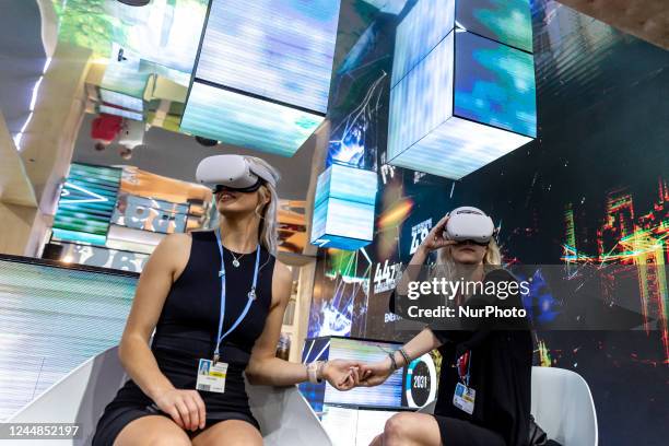 Women watch 3D recording in the Brasilian Pavilion during the COP27 UN Climate Change Conference, held by UNFCCC in Sharm El-Sheikh International...