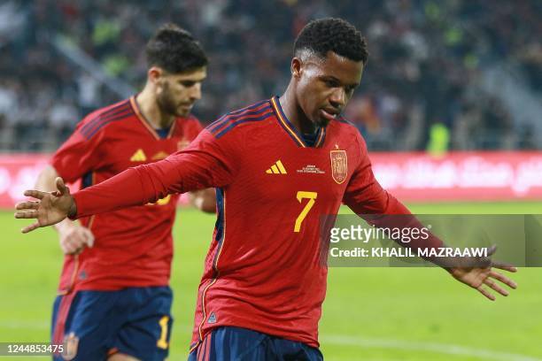 Spain's forward Ansu Fati celebrates scoring during the friendly football match between Jordan and Spain, at the Hussein Youth City stadium, in the...