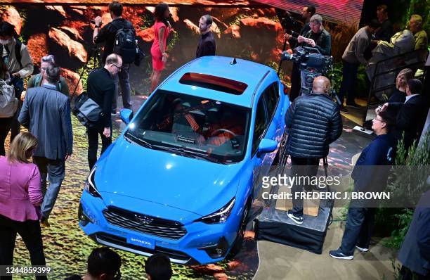 People view the new Subaru Impreza unveiled today at the Los Angeles Auto Show in Los Angeles, California on November 17, 2022.